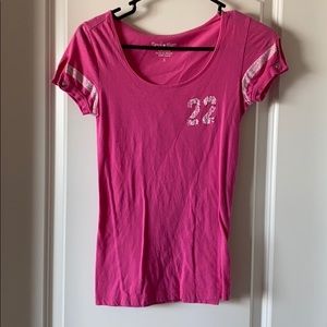 Pink shirt with white screen print.
